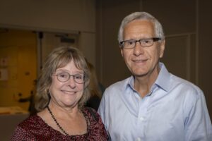 A man and woman standing next to each other.