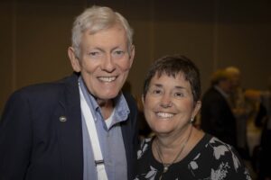 A man and woman smile for the camera.