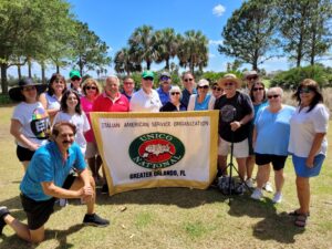 A group of people standing around each other.