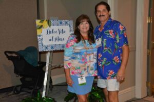 A man and woman posing for a picture.