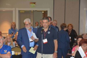 A group of people standing around each other.