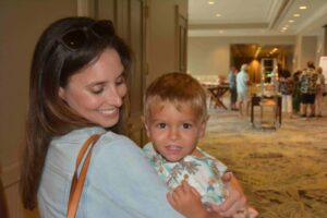 A woman holding a child in her arms.